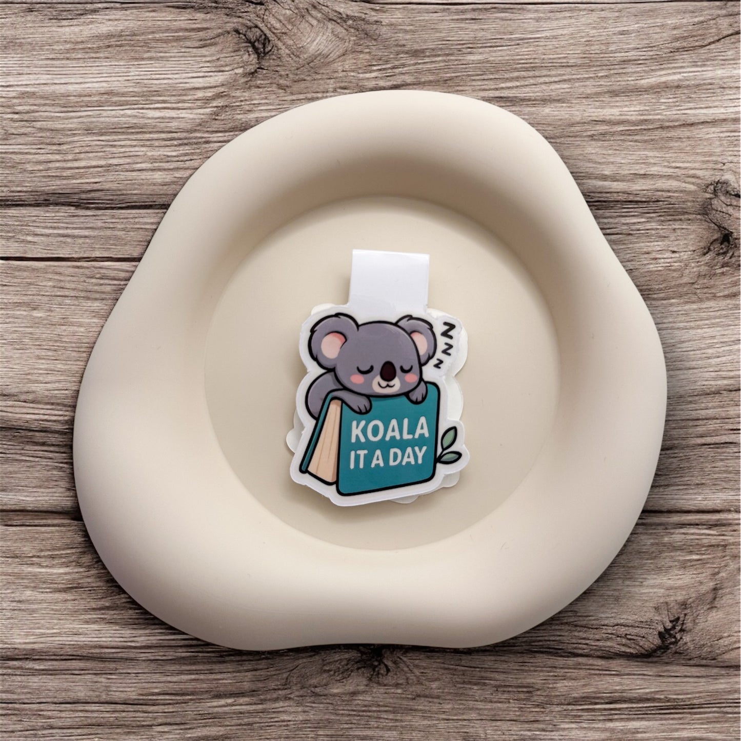 Done for the day? This soft koala bookmark comforts gentle readers and introverts who honour their quiet exit. — Handmade sticker — Perth, Australia