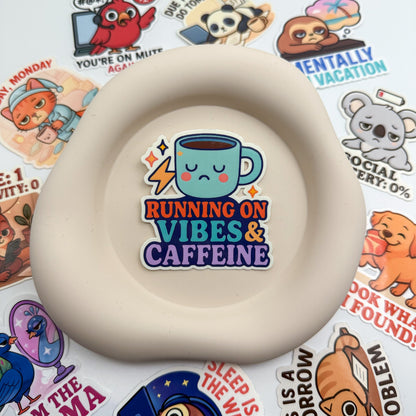 Overloaded mood meets steady sips in this Australian caffeine sticker. A visual sigh for hustle-weary souls.