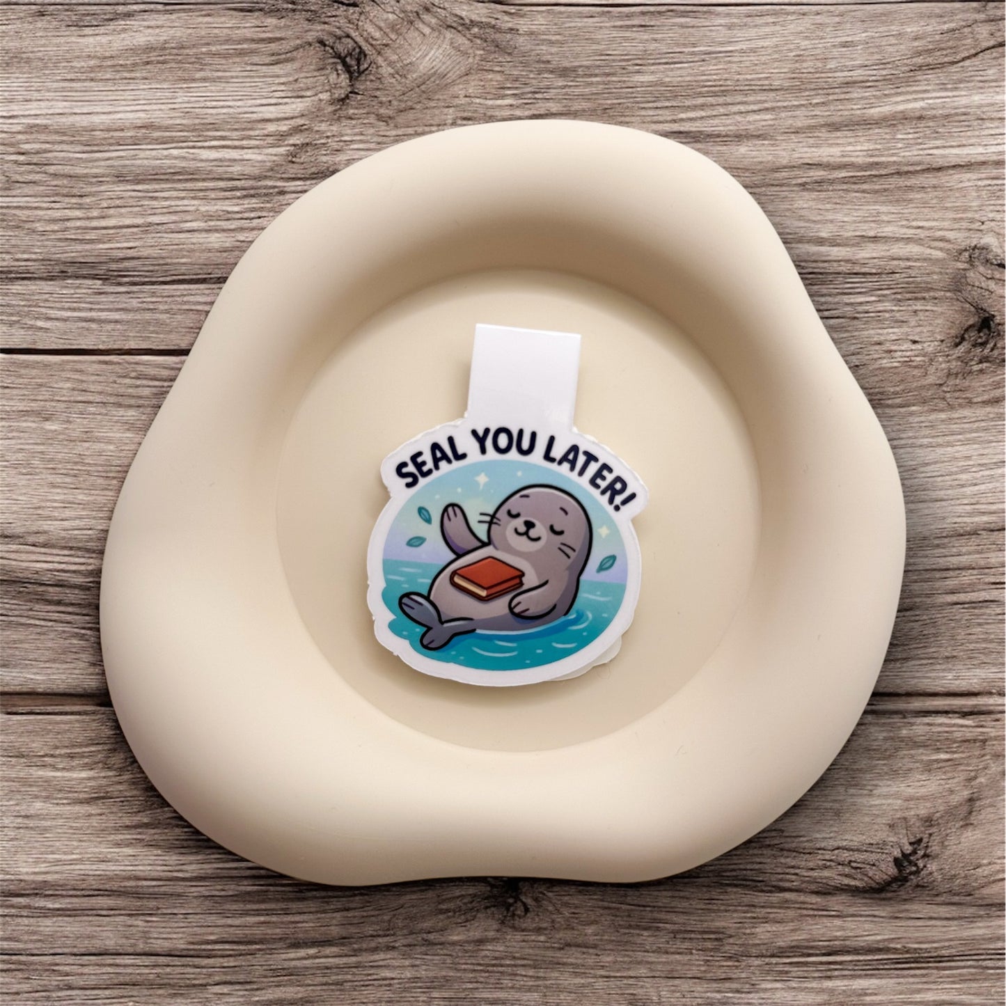 Feeling overstimulated? This soft seal magnetic bookmark offers a quiet farewell for sensitive readers who value space before they re-enter. — Handmade sticker — Perth, Australia
