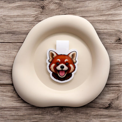 Scattered thoughts meet stillness in this red panda magnetic bookmark, designed for introverted readers and gentle souls.