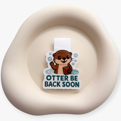 For those who pause but never disappear, this otter marker signals care and return for emotionally attuned book lovers.